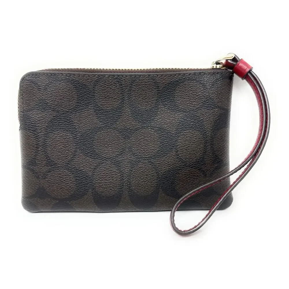 Coach Corner Zip Wristlet In Signature Canvas Brown Red